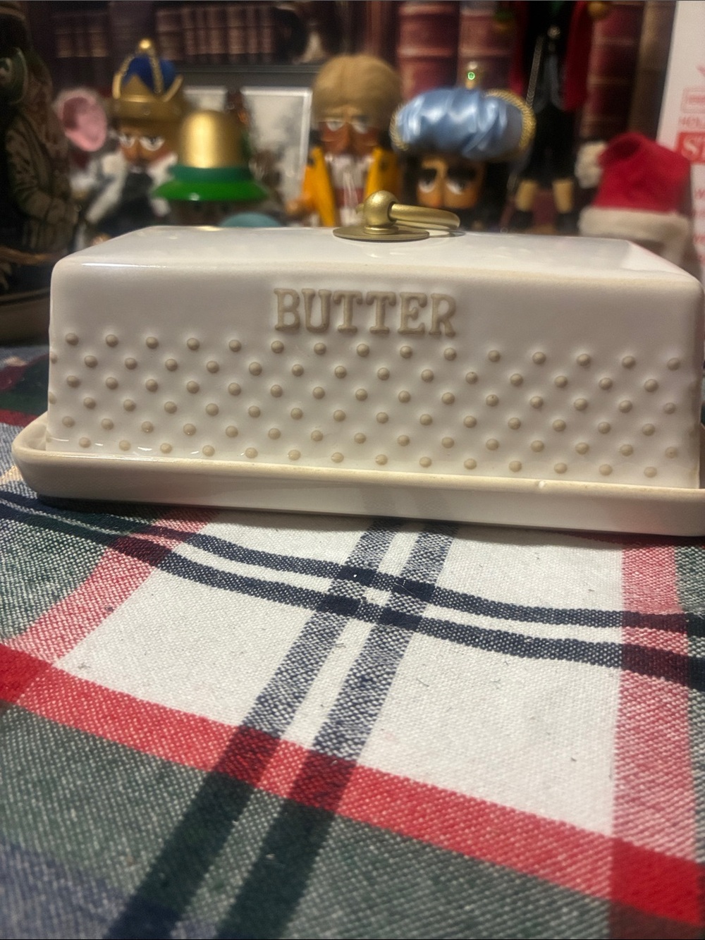 Vintage ceramic Butter dish with raised embossing and brass ring on lid.